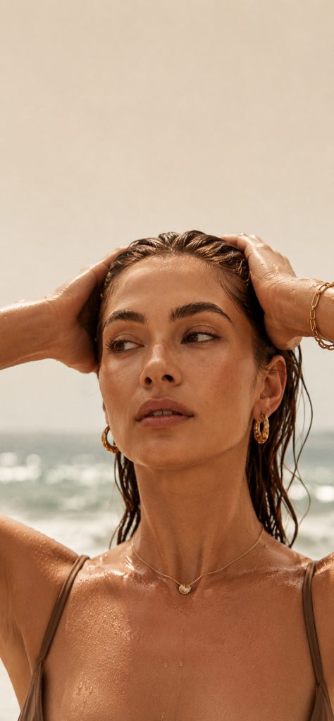 Woman with smooth skin by the sea – laser hair removal at AFACIAL in Vienna